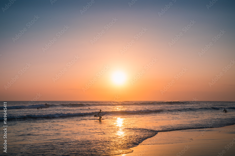 Sunset Background Ocean. Panoramic Landscape with Surfer. Summer Sea water. Beach Sunset Sea. Wonderful sea view. Sea View Blue Background. Sunset Beach in a Blue Background Ocean. Panorama