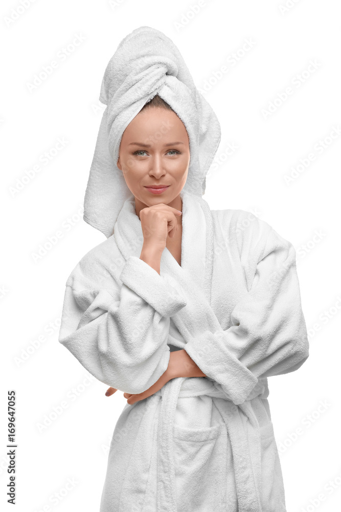 Beautiful young woman in bathrobe after shower on white background Beautiful young woman in bathrobe after shower on white background