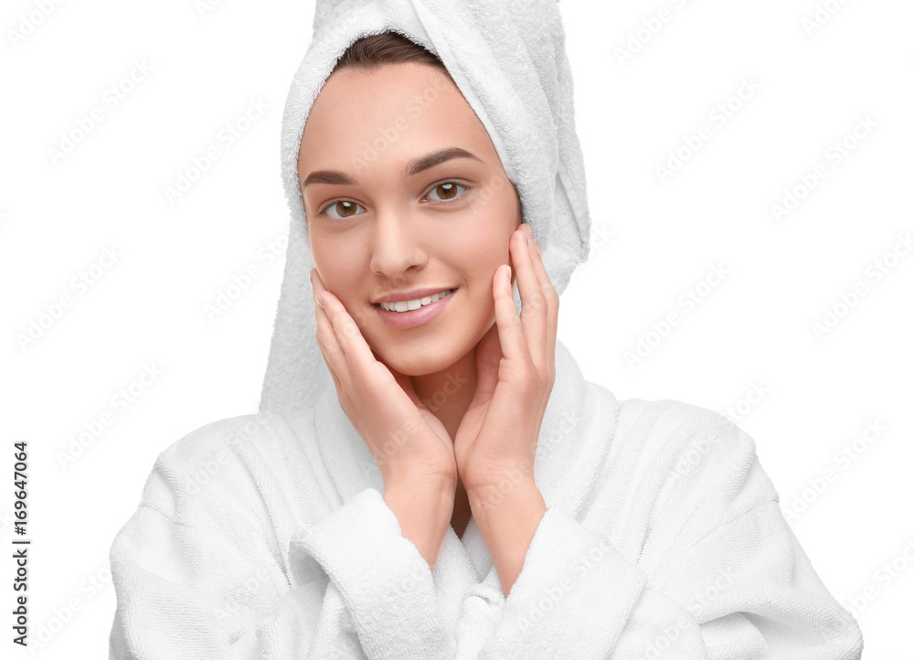 Beautiful young woman in bathrobe after shower on white background Beautiful young woman in bathrobe after shower on white background