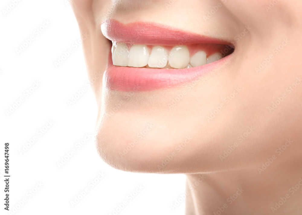 Obraz premium Beautiful young woman with healthy teeth on white background