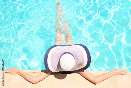 Beautiful young woman in swimming pool