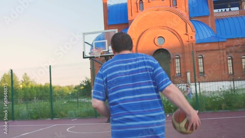 Young Guy Play Street Basketball photo