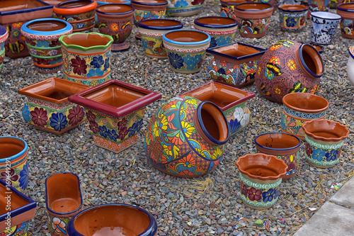 Hand made and painted colored pottery for sale at local street market photo
