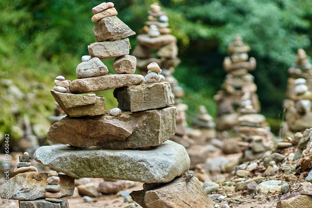 Fototapeta premium Stones arranged zen-like by the river