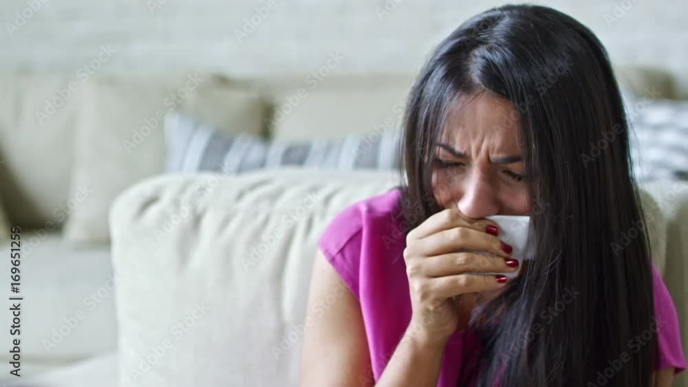 Zoom out of sad Latin woman with handkerchief crying hysterically and shaking her head during appointment with unrecognizable psychotherapist Zoom out of sad Latin woman with handkerchief crying hysterically and shaking her head during appointment with unrecognizable psychotherapist