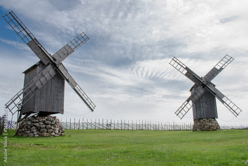 Two wooden old mill standing still Two wooden old mill standing still