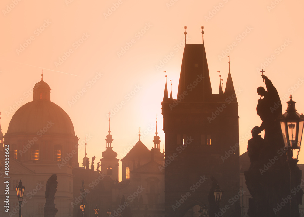 Sunrise over Charles Bridge and Old Town towers, Prague, Czech Republic.