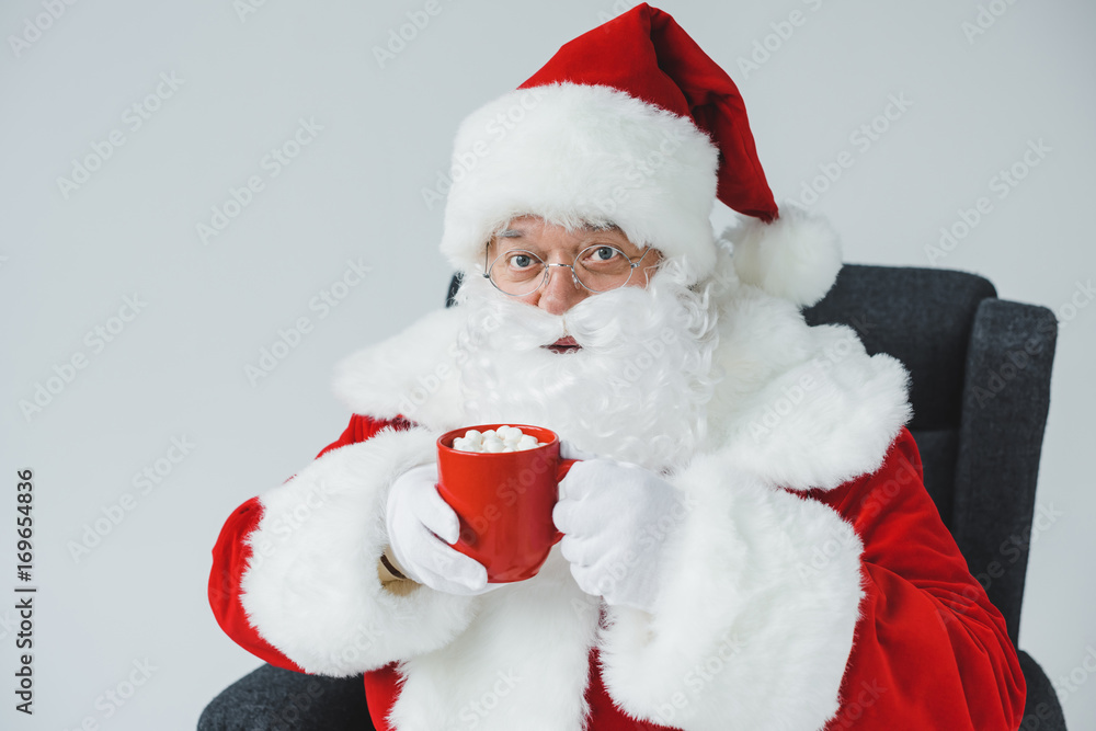 santa drinking hot chocolate with marshmallows santa drinking hot chocolate with marshmallows