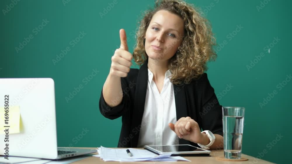 Business Woman Showing Thumbs Up In Office Working With Laptop. 4K. Business Woman Showing Thumbs Up In Office Working With Laptop. 4K.
