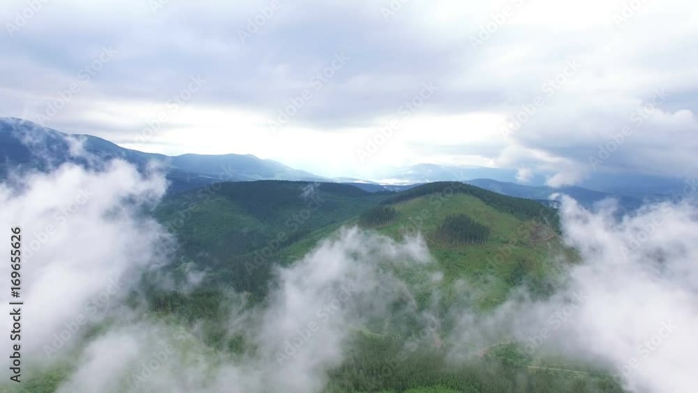 4K .Aerial. Fly up over mountains and among clouds.Panorama 4K .Aerial. Fly up over mountains and among clouds.Panorama