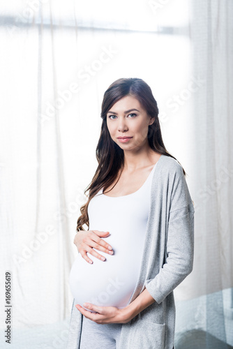 Pregnant woman touching belly Free Download Pregnant woman touching belly - GFXLoad