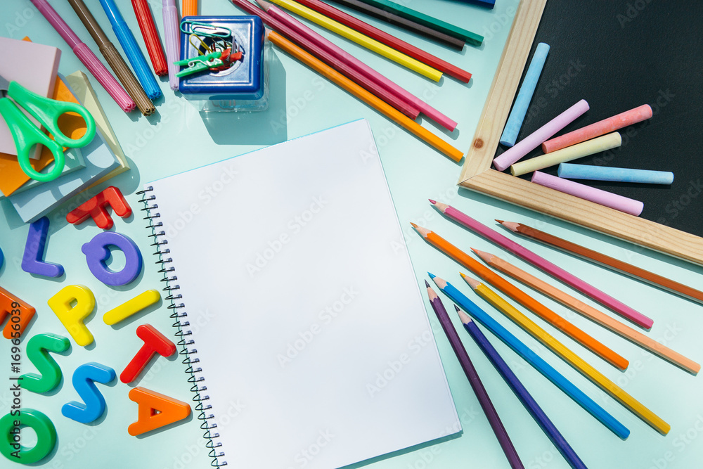 Notepad and blackboard with pencils Notepad and blackboard with pencils