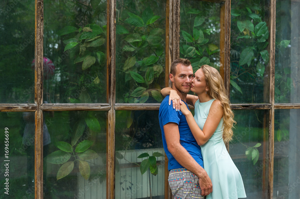 Portrait of young romantic couple in a botanical garden Portrait of young romantic couple in a botanical garden