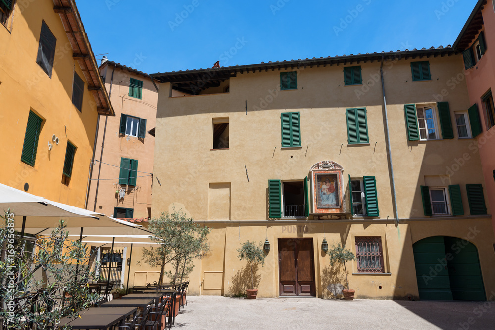 Fototapeta premium Exterior of typical Italian buildings in Lucca, Tuscany, Italy.