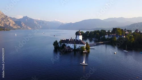 Wallpaper Mural Schloss Ort castle in lake Traunsee (Austria) - Aerial footage at sunset Torontodigital.ca