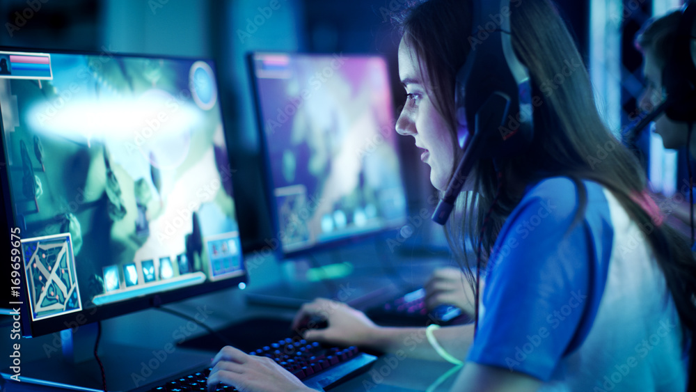 Man gamer teaching his girlfriend playing space shooter video game on RGB  powerful personal computer. Pro cyber woman with headset performing video  games streaming from home during online tournament Stock Photo 