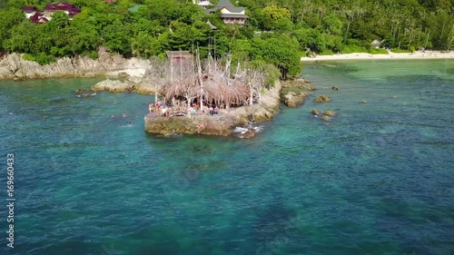 Drone flying above Haad Son sand beach and Secret beach at koh Phangan island,Thailand photo