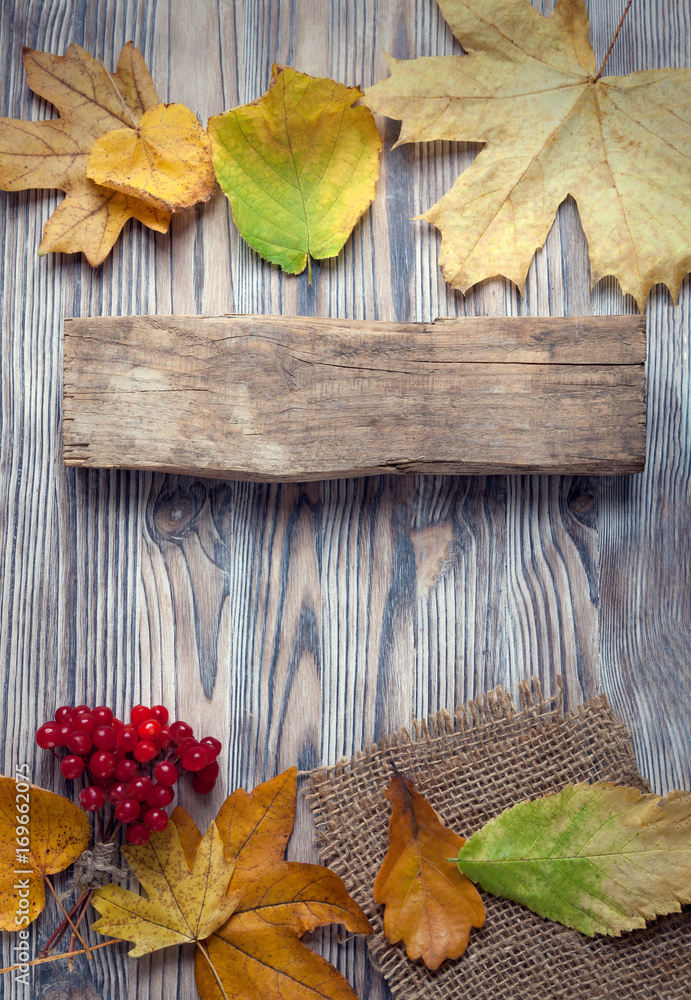 autumn background with signboard, orange leaf on old grunge wood deck, copy place for inscription, Top view, tablet for text. autumn background with signboard, orange leaf on old grunge wood deck, copy place for inscription, Top view, tablet for text.