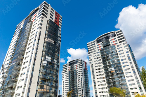 modern apartment buildings against blue sky