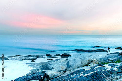 The view of the sand beach and sea wave with rock and reef on morning with sunrise, Beautiful of sand beach and sea and rock on morning