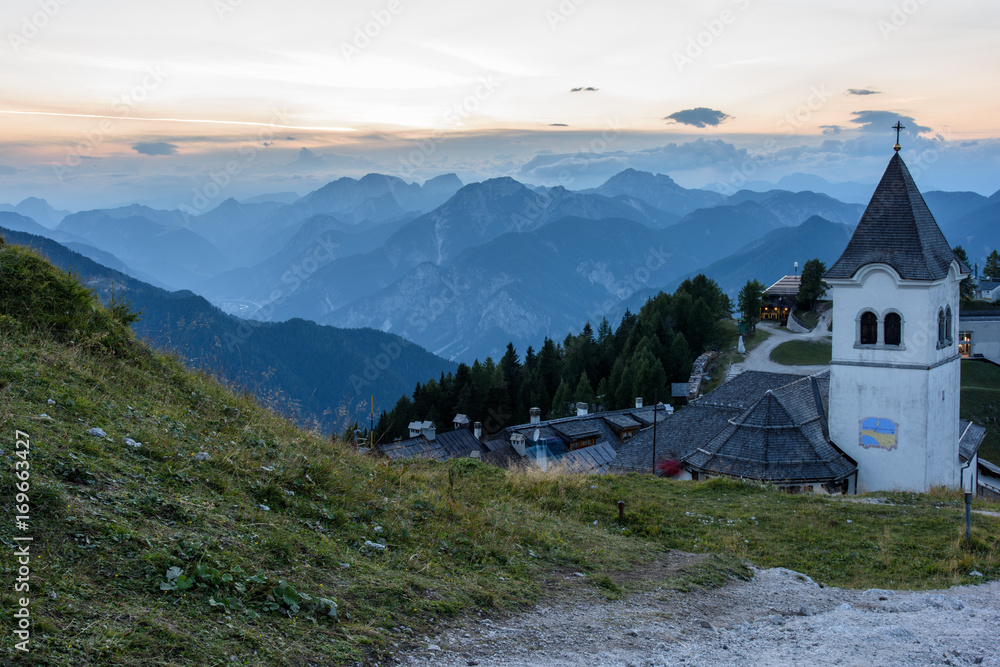 Mountain escape. Panorama from Mount Lussari at sunset