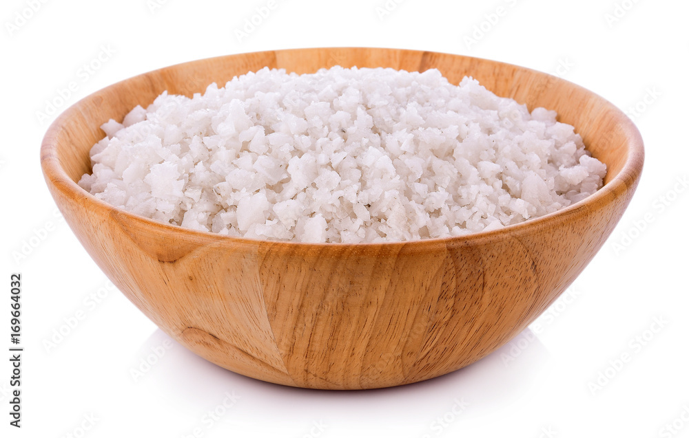 Sea salt in wooden bowl on white background Sea salt in wooden bowl on white background