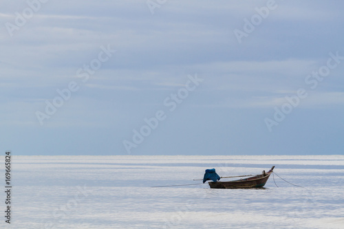 fishing boat floating on the sea background