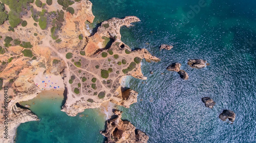 Aerial. View from the sky of the mountain capes on shores of Portimao.