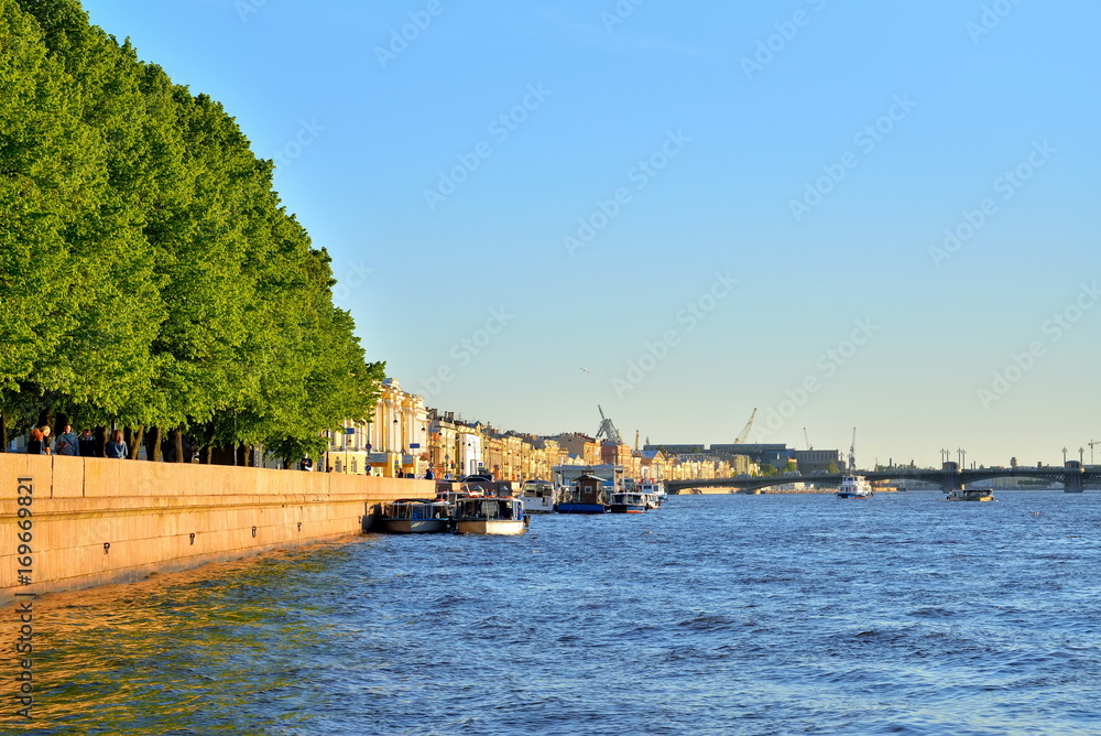 View on the Admiralty embankment on the Neva river with water in Saint-Petersburg