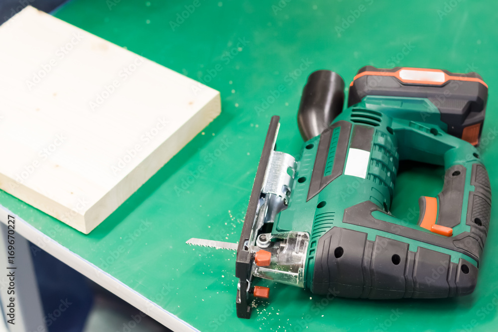 electric fretsaw on a table electric fretsaw on a table