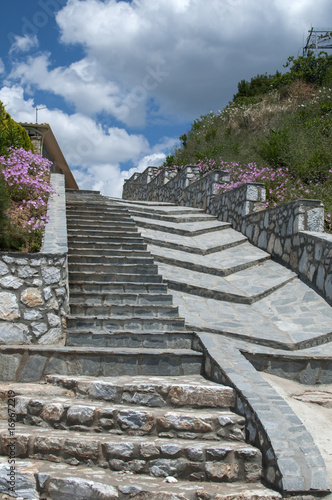 Steps with stone slabs blue sky and white clouds background
