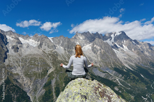Yoga meditation in mountain top © captblack76
