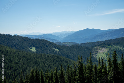 View of Pietrele Doamnei montain (Lady's stones cliff) from the valley. Rarau mountains in Bucovina, Romania