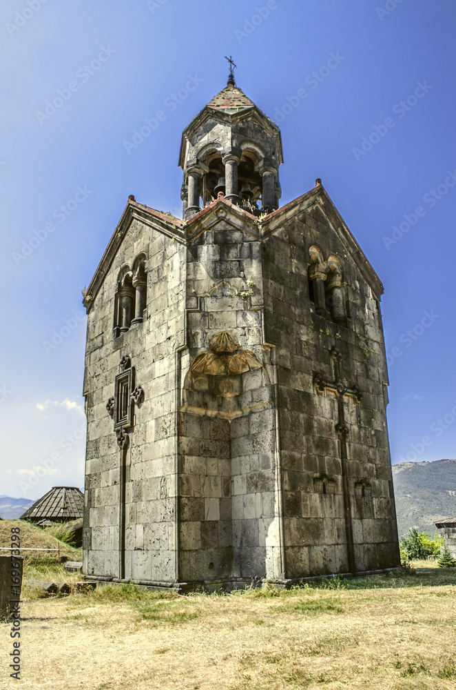 Three naves,the bell tower with the umbrella dome in the monastery of Gregory the Illuminator in Armenian village of Haghpat
