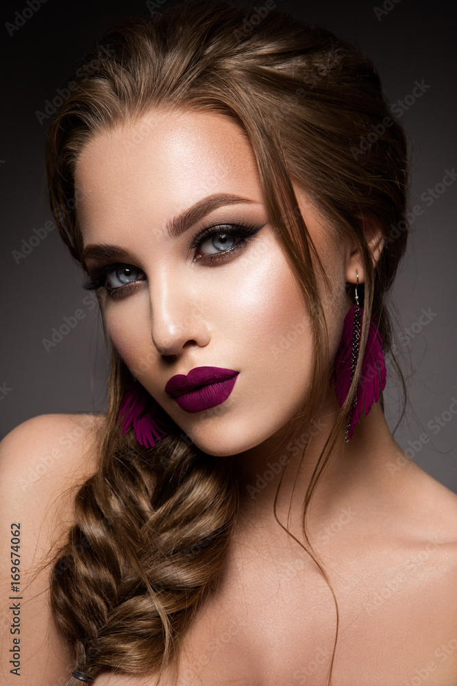 Glamour portrait of beautiful girl model with makeup and romantic hairstyle. Fashion shiny highlighter on skin, sexy gloss lips make-up and dark eyebrows. Pink lips Glamour portrait of beautiful girl model with makeup and romantic hairstyle. Fashion shiny highlighter on skin, sexy gloss lips make-up and dark eyebrows. Pink lips
