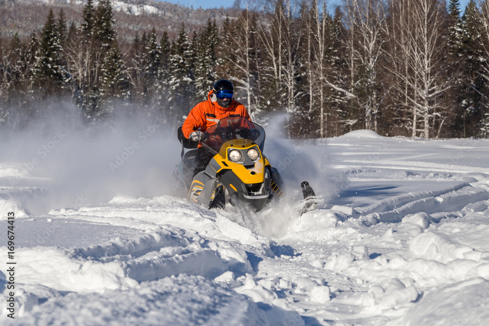 Athlete on a snowmobile