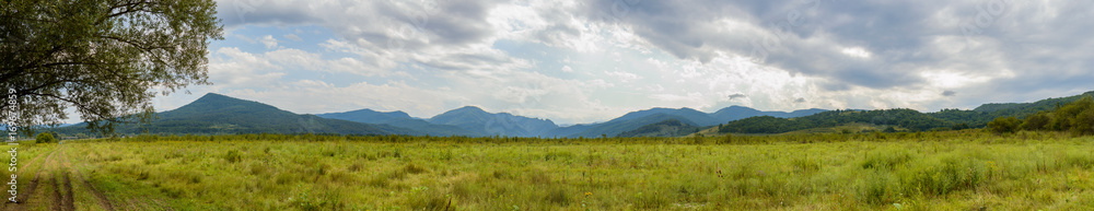 Panoramic view of valley in mountain landscape at the foot of the Caucasus Mountains, Adygea, Russia