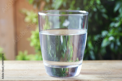 drinking water on wood background