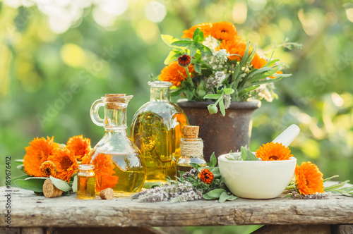 Spa composition with Fresh herbs, calendula and different types of oils.