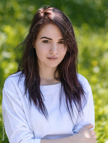 Outdoors portrait of beautiful young woman.