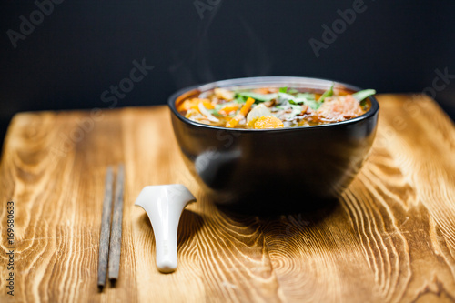 Rich flavor beef stew in the bowl on wooden table 