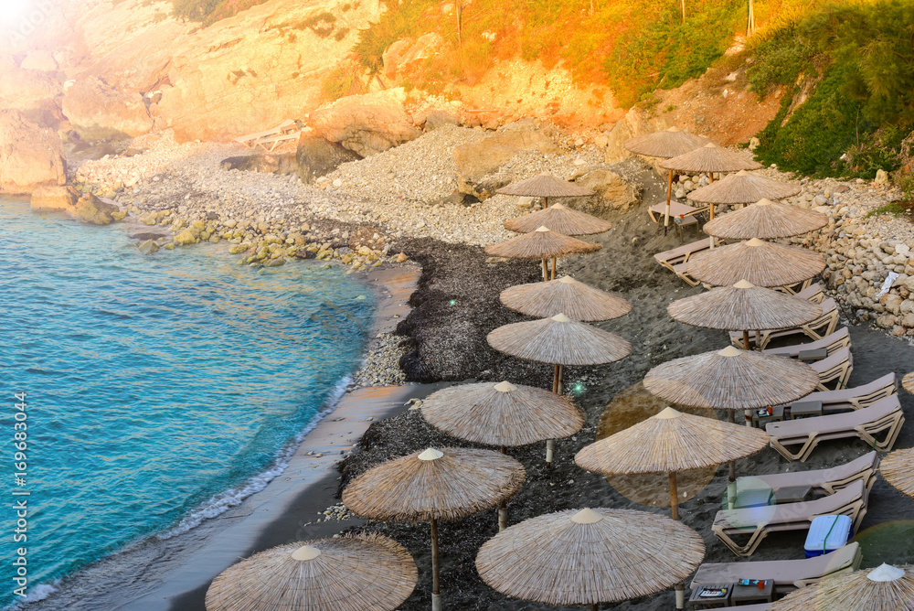 Fototapeta premium Beach umbrellas on the island of Crete.