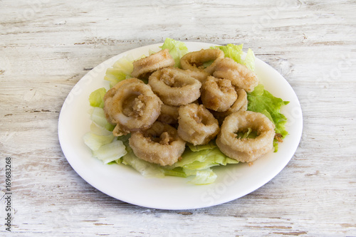 Fried calamari served on a plate.