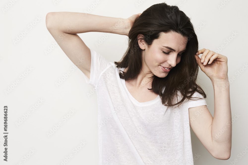 Gorgeous brunette woman in studio, looking down Gorgeous brunette woman in studio, looking down
