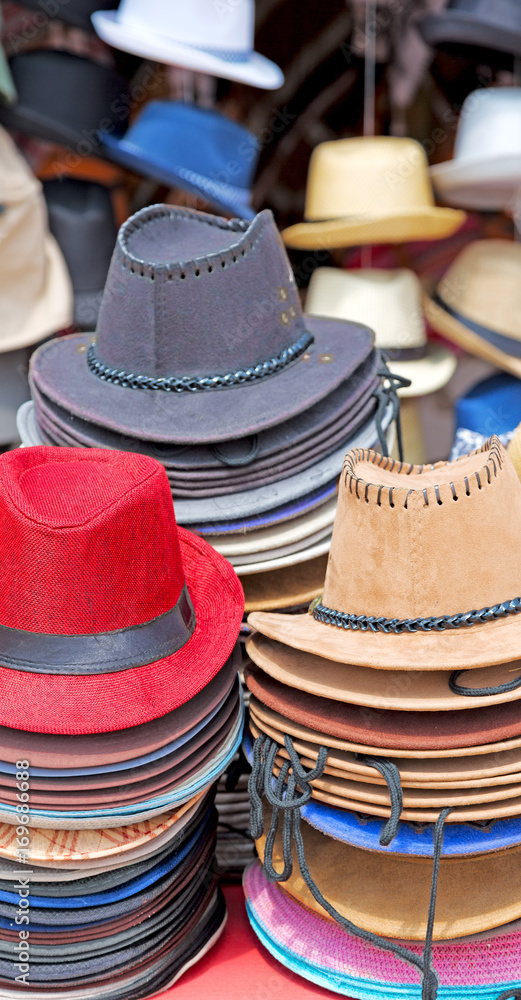 in a old market lots of colorated hats