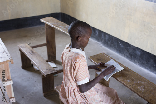 School girl studying in the classroom