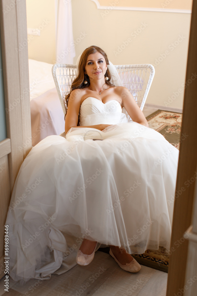 A happy bride is resting, after a photo session A happy bride is resting, after a photo session
