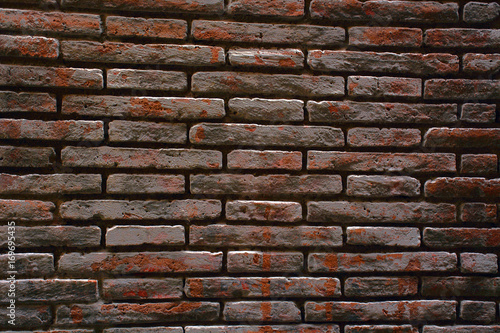 Brick wall of dark color background