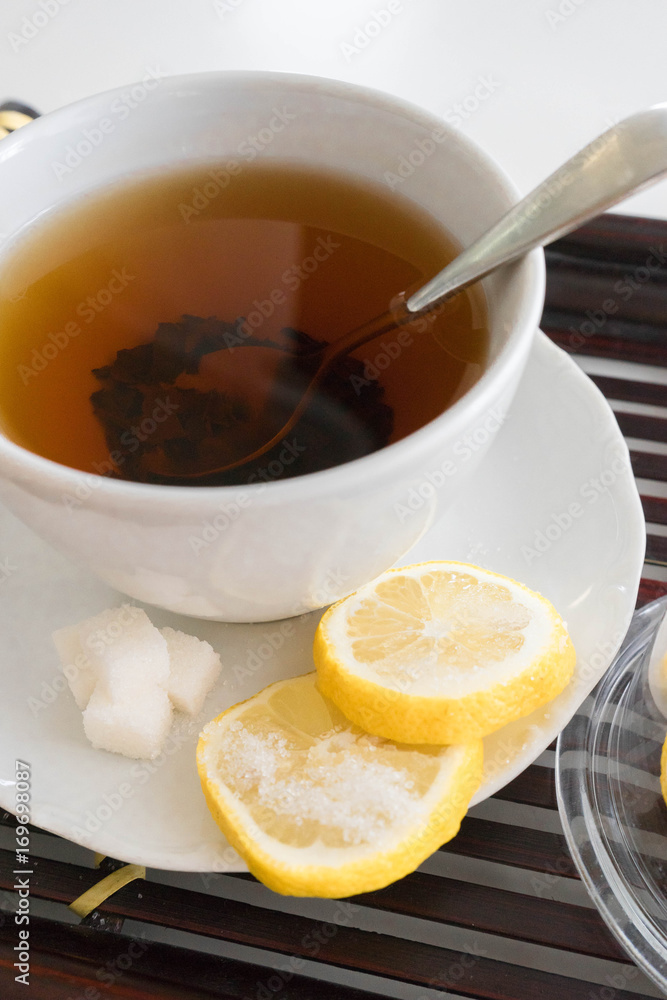 Hot tea with lemon and sugar Hot tea with lemon and sugar