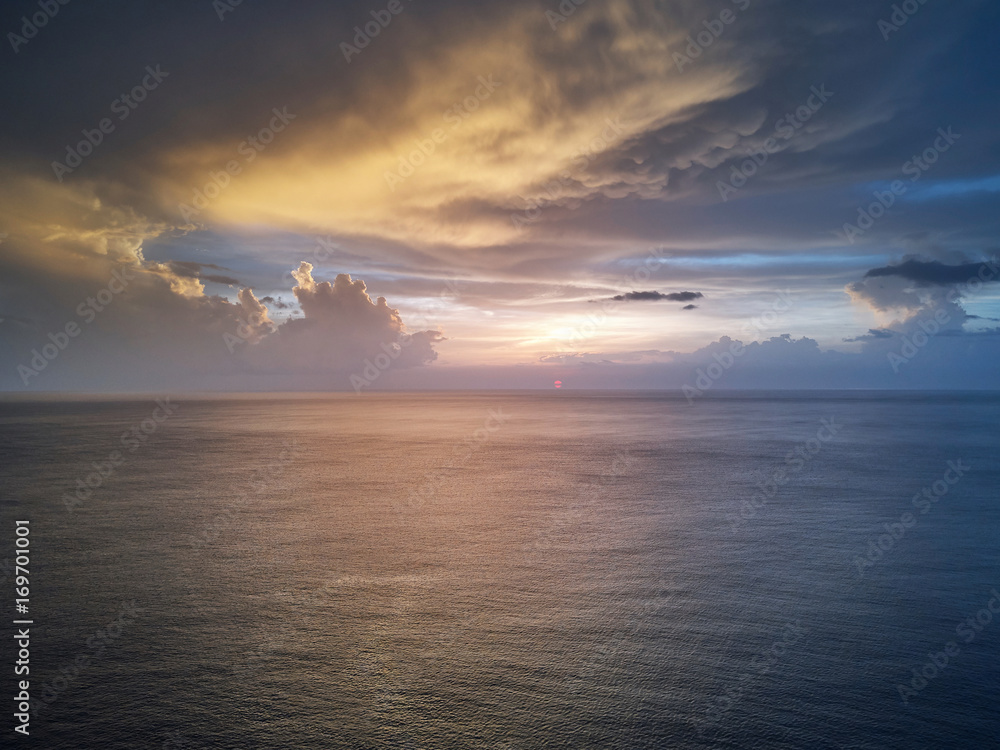 Sunset over calm ocean water